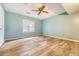 Bedroom with wood-look flooring, a ceiling fan, and a window at 4606 Moss Ct, North Charleston, SC 29420