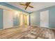 Bedroom with wood-look floors, three closets and a ceiling fan at 4606 Moss Ct, North Charleston, SC 29420