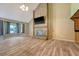 Large living room with a stone fireplace, wet bar, high ceilings, and hardwood floors offering ample space at 4606 Moss Ct, North Charleston, SC 29420