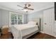 Bedroom with hardwood floors, ceiling fan, and a window view at 5195 Forest Oaks Dr, Hollywood, SC 29449