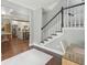 Inviting foyer and staircase with views of the dining room and the kitchen at 5195 Forest Oaks Dr, Hollywood, SC 29449