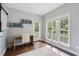 Bright office space with a desk and windows offering serene outdoor views at 5195 Forest Oaks Dr, Hollywood, SC 29449
