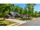 Aerial shot displays this neighborhood home with a two-car garage and mature trees at 5442 Clearview Dr, North Charleston, SC 29420