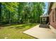 Expansive backyard with a screened-in porch, patio, and lush greenery at 5442 Clearview Dr, North Charleston, SC 29420