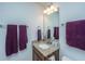 Stylish bathroom with granite vanity, ample lighting, and a decorative towel arrangement at 5442 Clearview Dr, North Charleston, SC 29420