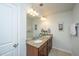 Elegant bathroom features a double sink vanity with granite countertops and stylish lighting at 5442 Clearview Dr, North Charleston, SC 29420