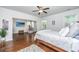 A spacious bedroom with hardwood floors, ample windows, and a cozy seating area near the TV at 5442 Clearview Dr, North Charleston, SC 29420