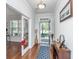 Inviting foyer with hardwood floors, features a decorative rug, console table, and an open doorway to a bright, airy space at 5442 Clearview Dr, North Charleston, SC 29420