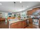 Open-concept kitchen seamlessly connects to the living area, featuring a granite island and stainless steel appliances at 5442 Clearview Dr, North Charleston, SC 29420