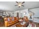 An inviting living room with an open layout, hardwood floors, and seamless transition into kitchen and dining areas at 5442 Clearview Dr, North Charleston, SC 29420