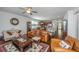 A cozy living room with a decorative rug, comfortable sofas and a seamless view into the kitchen at 5442 Clearview Dr, North Charleston, SC 29420