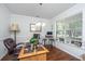 A bright home office with a desk, chair, and a window offering natural light and view of the outdoors at 5442 Clearview Dr, North Charleston, SC 29420
