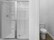 Bathroom with a glass shower and toilet at 6039 Savy Ct, Ravenel, SC 29470