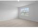 Bright bedroom with neutral carpet, a window, and white walls at 6039 Savy Ct, Ravenel, SC 29470