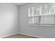 Bright bedroom with a large window and natural light at 6039 Savy Ct, Ravenel, SC 29470