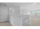 Hallway with neutral carpet, white walls, and stairs at 6039 Savy Ct, Ravenel, SC 29470