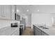Contemporary kitchen with gray cabinets, granite countertops, stainless appliances, and a large island with a sink at 6039 Savy Ct, Ravenel, SC 29470