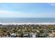 Panoramic aerial view of the property, nestled among lush trees with a stunning ocean backdrop at 622 E Cooper Ave, Folly Beach, SC 29439