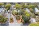 Stunning aerial view of a lush property with mature landscaping, charming home, and ample parking space at 622 E Cooper Ave, Folly Beach, SC 29439