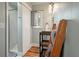 Bright and clean bathroom with white vanity, sliding door shower, and shiplap accent walls at 622 E Cooper Ave, Folly Beach, SC 29439