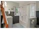 Stylish bathroom with custom shower, vintage accents, and bright natural light at 622 E Cooper Ave, Folly Beach, SC 29439
