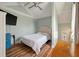 This inviting bedroom features sloped ceilings, hardwood floors and a full-size bed at 622 E Cooper Ave, Folly Beach, SC 29439