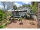 Inviting home showcasing lush greenery, a stone walkway, and a charming, well-maintained facade at 622 E Cooper Ave, Folly Beach, SC 29439