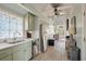 Kitchen with stainless appliances, shaker cabinets, open layout, and decor at 622 E Cooper Ave, Folly Beach, SC 29439