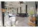 Bright living room featuring vaulted ceilings, eclectic decor, and large windows at 622 E Cooper Ave, Folly Beach, SC 29439