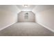 Bright bonus room with vaulted ceilings, neutral carpet, and a window providing ample natural light at 769 Maynard Ln, Summerville, SC 29486