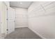 Walk-in closet featuring wire shelving and neutral carpeting providing ample storage space at 769 Maynard Ln, Summerville, SC 29486