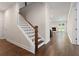 View of staircase and an open floor plan into the living room with fireplace at 769 Maynard Ln, Summerville, SC 29486