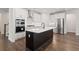 Modern kitchen features a large island, stainless steel appliances, and white cabinets at 769 Maynard Ln, Summerville, SC 29486