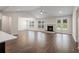 Bright and airy living room featuring hardwood floors, a fireplace, and French doors leading to the outside at 769 Maynard Ln, Summerville, SC 29486