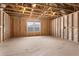 Unfinished room framed with wooden beams and a window, presenting a versatile opportunity at 769 Maynard Ln, Summerville, SC 29486