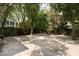 Backyard with plenty of space, surrounded by greenery and providing a serene outdoor setting at 8 Pitt St # A, Charleston, SC 29401