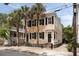 Charming two-story home with black shutters and palm trees at 8 Pitt St # A, Charleston, SC 29401