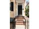 Charming front door with brick steps and black iron fence at 8 Pitt St # A, Charleston, SC 29401