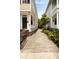 Home exterior showing brick foundation and gravel driveway at 8 Pitt St # A, Charleston, SC 29401