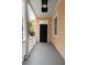 Inviting front porch featuring classic columns and a welcoming black door, enhancing curb appeal at 8 Pitt St # A, Charleston, SC 29401