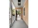 Home front porch with black door and overhead lighting at 8 Pitt St # A, Charleston, SC 29401