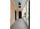 Home front porch with black door and overhead lighting at 8 Pitt St # A, Charleston, SC 29401