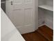 A close-up view of a kitchen door and quartz countertop, complemented by beautiful hardwood floors at 8 Pitt St # A, Charleston, SC 29401