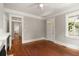 Living room with hardwood floors, white trim, and fireplace at 8 Pitt St # A, Charleston, SC 29401