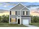Charming two-story home with gray siding, black shutters, and a well-manicured lawn at 8021 Rackham Rd, Hollywood, SC 29470