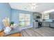 Modern kitchen is bathed in natural light and features granite countertops and gray cabinets at 8507 William Moultrie Dr, North Charleston, SC 29420