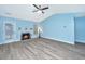 Spacious living room with a charming fireplace, stylish flooring and ample natural light at 8507 William Moultrie Dr, North Charleston, SC 29420