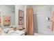 Cozy bathroom featuring a shower over the tub at 8840 Shovelnose Ct, North Charleston, SC 29406