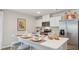 Stylish kitchen featuring white cabinets, stainless steel appliances, and a functional island at 8840 Shovelnose Ct, North Charleston, SC 29406