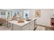 Bright kitchen featuring stainless steel appliances, island with a sink, and dining area nearby at 8840 Shovelnose Ct, North Charleston, SC 29406